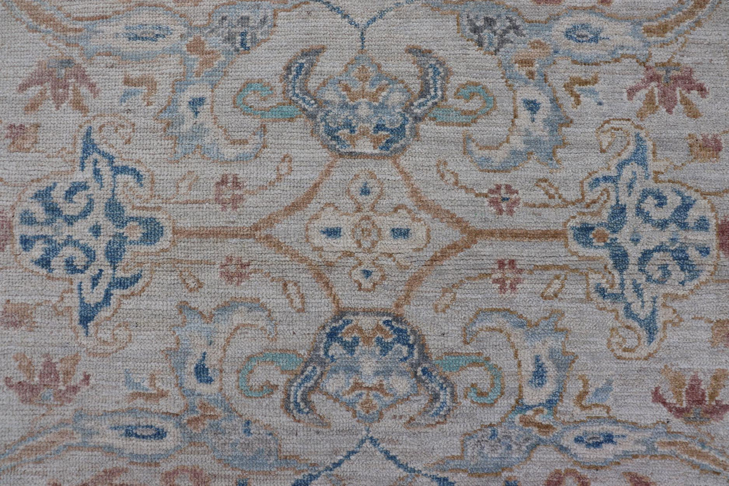 Arabesque All - Over Hand Knotted Oushak in Ivory and Blue Tones The field is backed by a ivory color, with a light blue border, etched with elegant golden/brown branches. The arabesque - like design brings splashes of light blue, cognac, and reddis... - Keivan Woven ArtsAWR - 6407 - 20079Rug