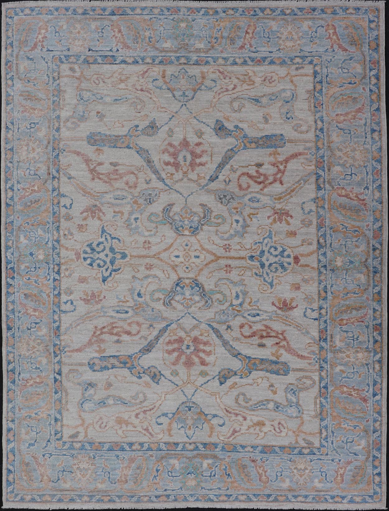 Arabesque All - Over Hand Knotted Oushak in Ivory and Blue Tones The field is backed by a ivory color, with a light blue border, etched with elegant golden/brown branches. The arabesque - like design brings splashes of light blue, cognac, and reddis... - Keivan Woven ArtsAWR - 6407 - 20079Rug