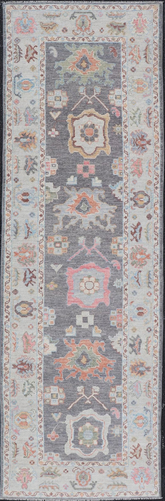 Hand Knotted Afghan Oushak Designed Runner with Gray Background This Afghan Oushak runner features a grand motif, showcasing from the border to the field with a vibrant elegance that pops against the light blue - gray border, as well as the charc... - Keivan Woven ArtsAWR - 6463 - 19911Rug