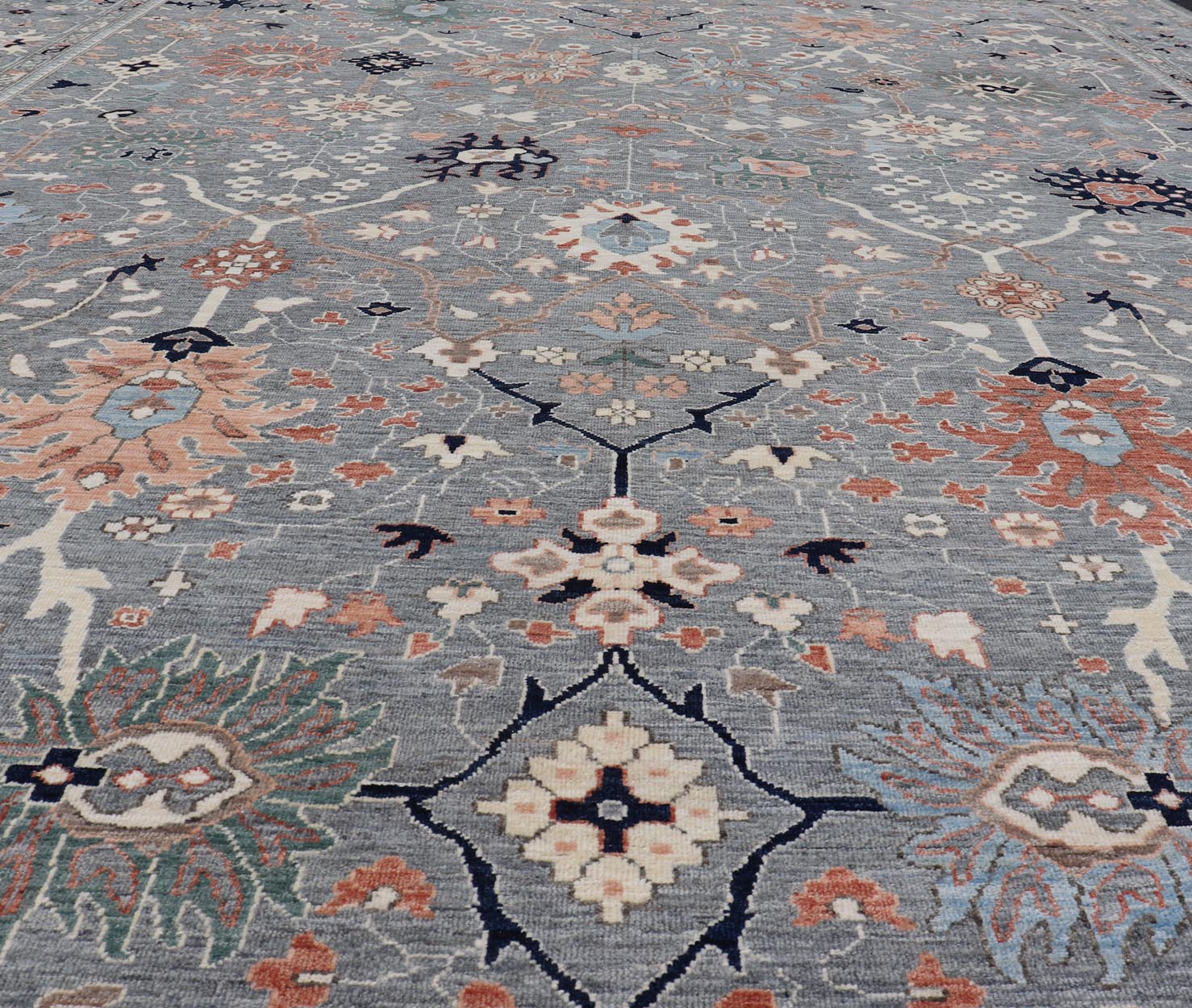 Large Afghan All - Over Designed Oushak with Gray Background and Bright Motifs This large Oushak was hand knotted in Afghanistan. Known for their floral - inspired motifs, this piece has a more modern feel with bright corals, pinks, greens and ... - Keivan Woven ArtsAWR - 6519 - 19917Rug