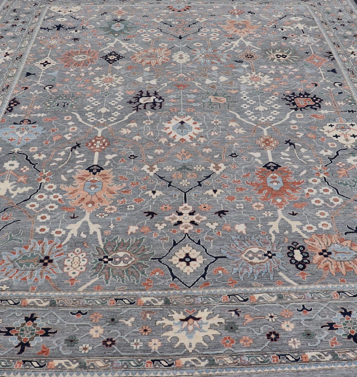 Large Afghan All - Over Designed Oushak with Gray Background and Bright Motifs This large Oushak was hand knotted in Afghanistan. Known for their floral - inspired motifs, this piece has a more modern feel with bright corals, pinks, greens and ... - Keivan Woven ArtsAWR - 6519 - 19917Rug