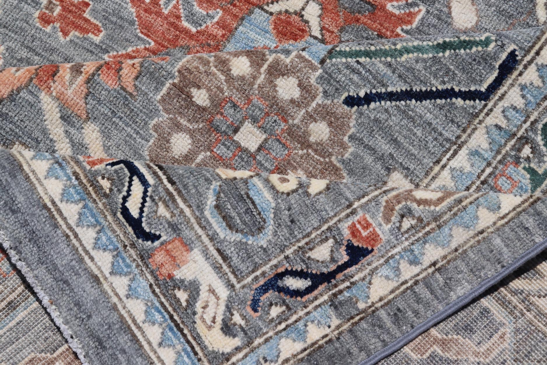 Large Afghan All - Over Designed Oushak with Gray Background and Bright Motifs This large Oushak was hand knotted in Afghanistan. Known for their floral - inspired motifs, this piece has a more modern feel with bright corals, pinks, greens and ... - Keivan Woven ArtsAWR - 6519 - 19917Rug