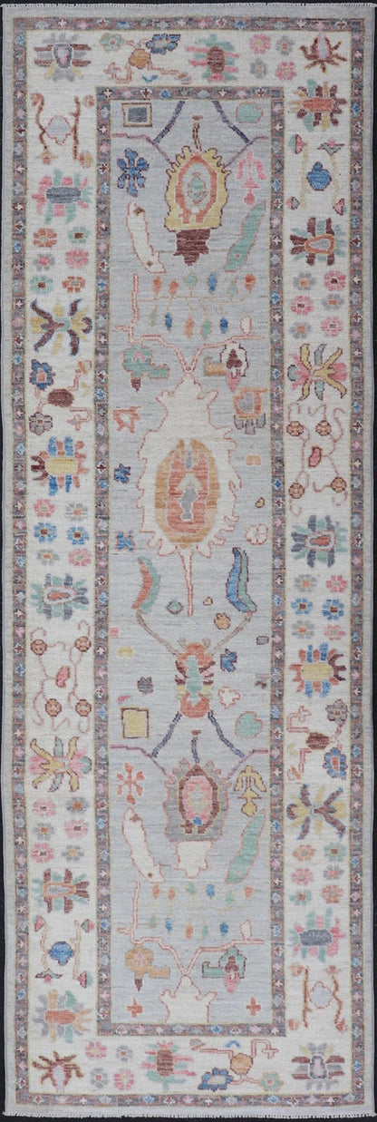 Measures: 3'1 x 10'0 Hand knotted in Afghanistan, this modern oushak runner showcasing the distinct large - scale angular floral design, with a modern bright splash of color against a cool gray background. The monotone cream - to - gray in the backgro... - Keivan Woven ArtsAWR - 6541 - 20085Rug