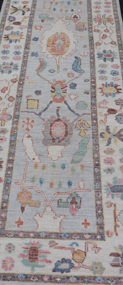 Measures: 3'1 x 10'0 Hand knotted in Afghanistan, this modern oushak runner showcasing the distinct large - scale angular floral design, with a modern bright splash of color against a cool gray background. The monotone cream - to - gray in the backgro... - Keivan Woven ArtsAWR - 6541 - 20085Rug