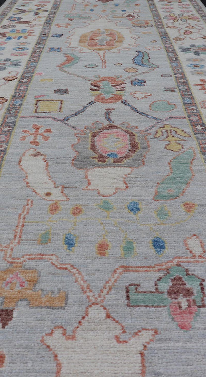 Measures: 3'1 x 10'0 Hand knotted in Afghanistan, this modern oushak runner showcasing the distinct large - scale angular floral design, with a modern bright splash of color against a cool gray background. The monotone cream - to - gray in the backgro... - Keivan Woven ArtsAWR - 6541 - 20085Rug
