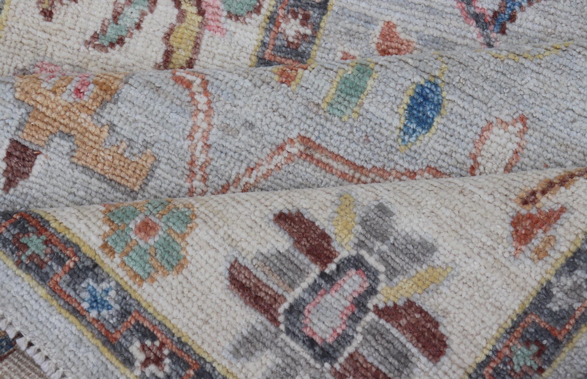 Measures: 3'1 x 10'0 Hand knotted in Afghanistan, this modern oushak runner showcasing the distinct large - scale angular floral design, with a modern bright splash of color against a cool gray background. The monotone cream - to - gray in the backgro... - Keivan Woven ArtsAWR - 6541 - 20085Rug