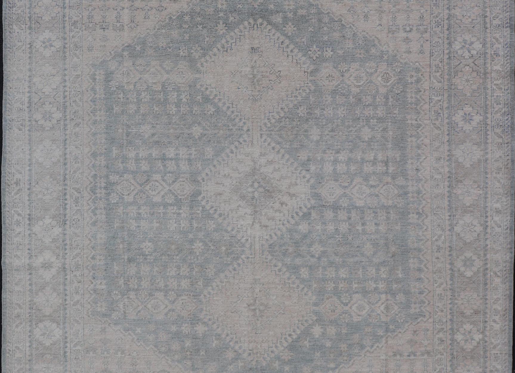 Modern Persian Shiraz Rug with Tribal Design in Light Blue Background and Taupe. Keivan Woven Arts/ rug AWR - 8003 Country of Origin: Afghanistan Type: Shiraz Design: Floral, Medallion Abstract - Tribal Measures: 8' x 9'9 This Shiraz present... - Keivan Woven ArtsAWR - 8003 - 21487Rug
