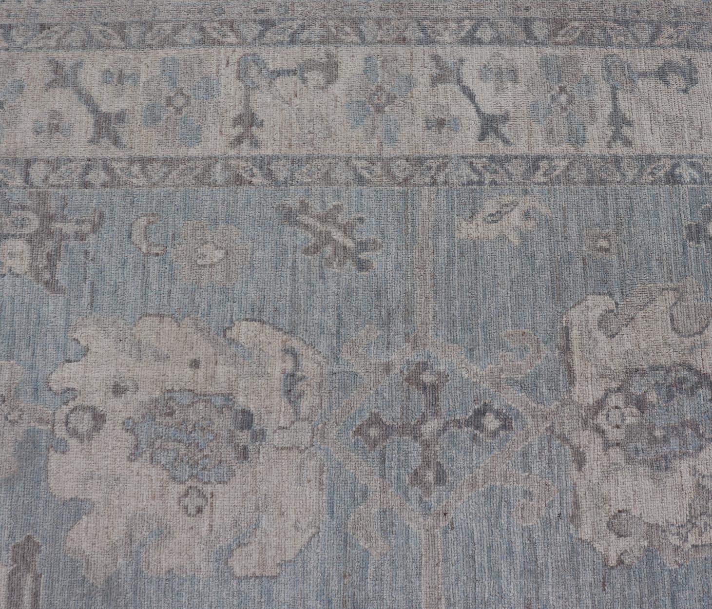 Modern Oushak with Floral and Tribal Motifs with Cream, Gray and Powder Blue. Keivan Woven Arts; rug AWR - 8234 Country of Origin: Afghanistan Type: Oushak Design: Floral, All - Over Abstract - Tribal 21st Century Measures: 9'11 x 13'10 This moder... - Keivan Woven ArtsAWR - 8234 - 21227Rug