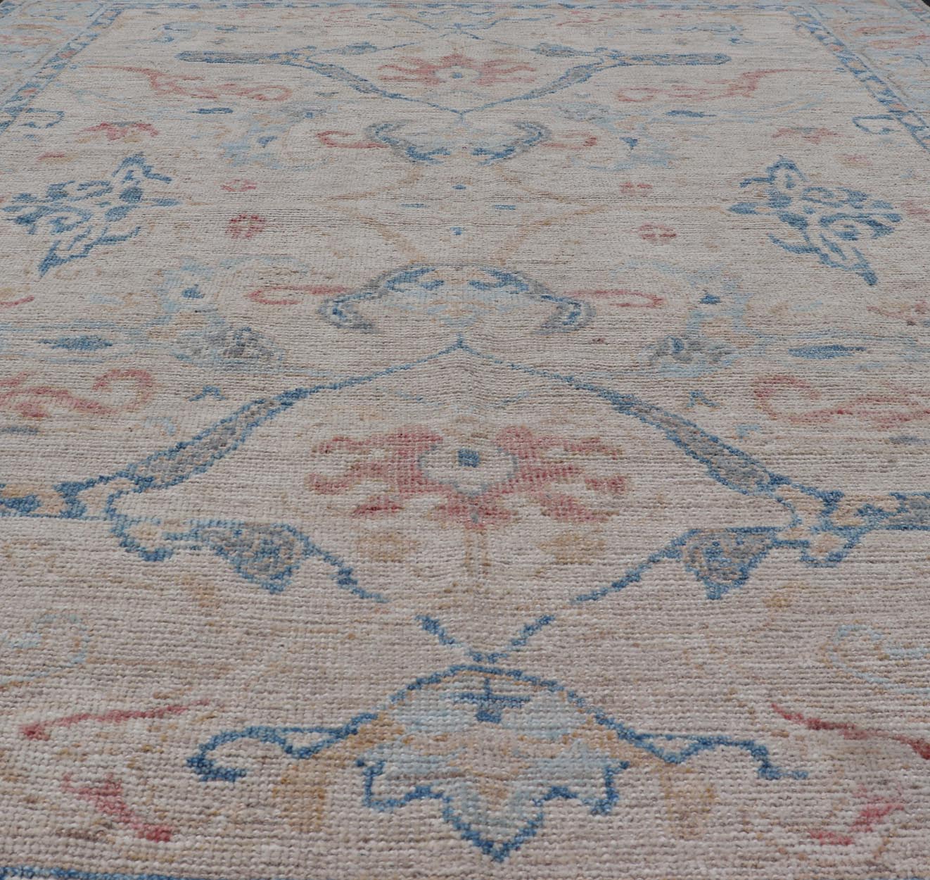 All - Over Hand Knotted Oushak Rug with Arabesque Design in Ivory and Blue Tones Hand knotted Oushak made in wool with a field is backed by a ivory color, with a light blue border, etched with elegant golden/brown branches. The arabesque - like des... - Keivan Woven ArtsAWR - 8252 - 21403Rug