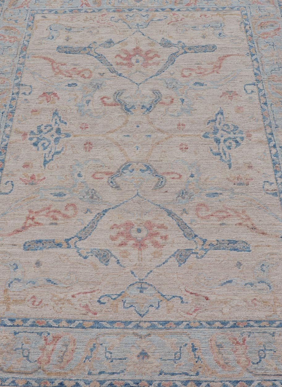 All - Over Hand Knotted Oushak Rug with Arabesque Design in Ivory and Blue Tones Hand knotted Oushak made in wool with a field is backed by a ivory color, with a light blue border, etched with elegant golden/brown branches. The arabesque - like des... - Keivan Woven ArtsAWR - 8252 - 21403Rug
