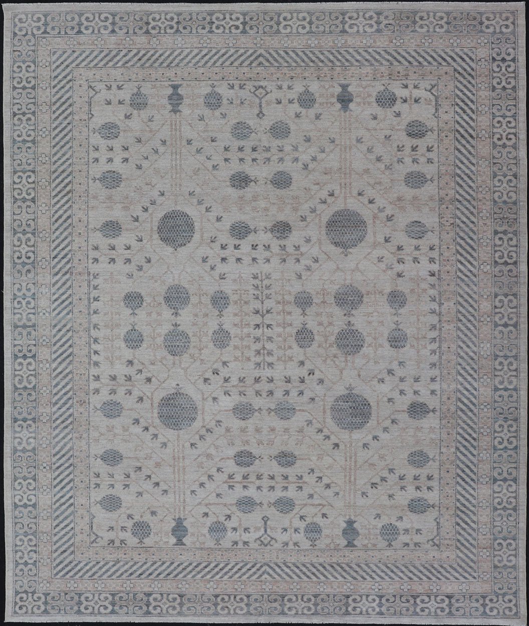 Modern Tribal Khotan Rug In Shades of Cream, Tan, and Light Teal This modern Khotan features a modern muted array of teal, cream, taupe. The background is a beautifully blended cream, topped by an intricate pomegranate design in teal . ... - Keivan Woven ArtsAWR - 8384 - 20836Rug