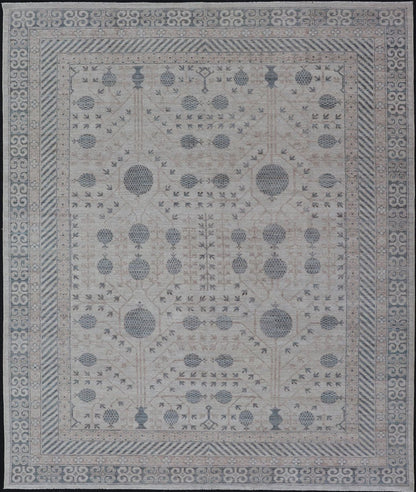 Modern Tribal Khotan Rug In Shades of Cream, Tan, and Light Teal This modern Khotan features a modern muted array of teal, cream, taupe. The background is a beautifully blended cream, topped by an intricate pomegranate design in teal . ... - Keivan Woven ArtsAWR - 8384 - 20836Rug
