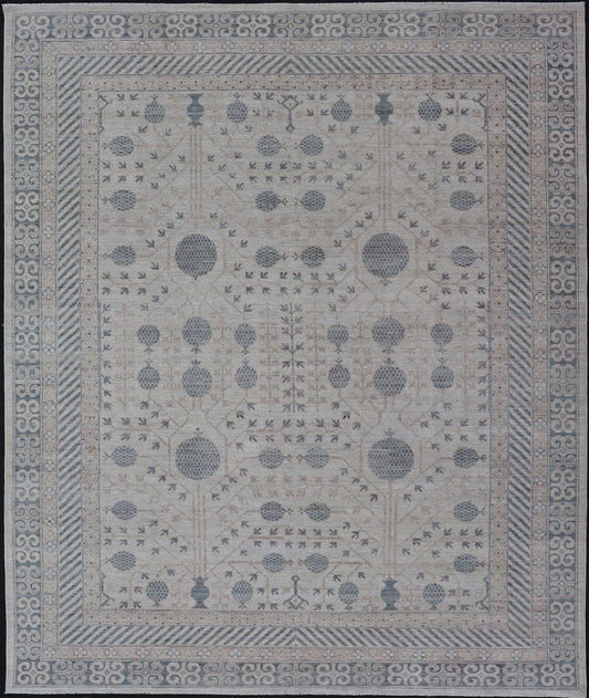 Modern Tribal Khotan Rug In Shades of Cream, Tan, and Light Teal This modern Khotan features a modern muted array of teal, cream, taupe. The background is a beautifully blended cream, topped by an intricate pomegranate design in teal . ... - Keivan Woven ArtsAWR - 8384 - 20836Rug