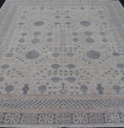 Modern Tribal Khotan Rug In Shades of Cream, Tan, and Light Teal This modern Khotan features a modern muted array of teal, cream, taupe. The background is a beautifully blended cream, topped by an intricate pomegranate design in teal . ... - Keivan Woven ArtsAWR - 8384 - 20836Rug