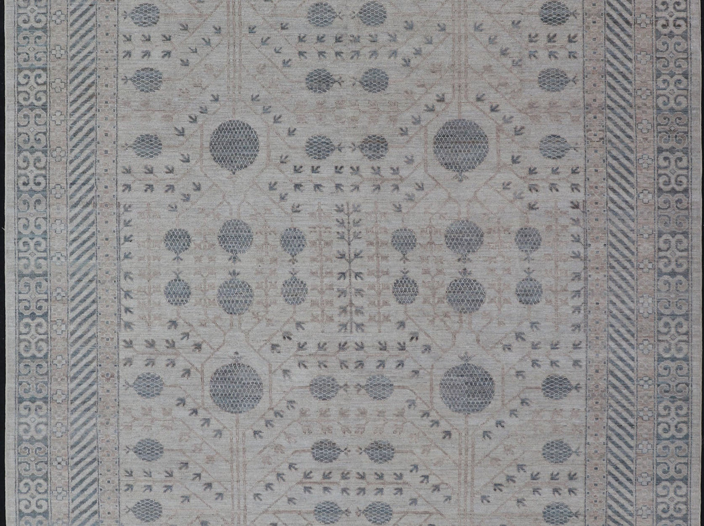 Modern Tribal Khotan Rug In Shades of Cream, Tan, and Light Teal This modern Khotan features a modern muted array of teal, cream, taupe. The background is a beautifully blended cream, topped by an intricate pomegranate design in teal . ... - Keivan Woven ArtsAWR - 8384 - 20836Rug
