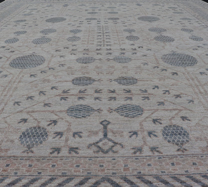 Modern Tribal Khotan Rug In Shades of Cream, Tan, and Light Teal This modern Khotan features a modern muted array of teal, cream, taupe. The background is a beautifully blended cream, topped by an intricate pomegranate design in teal . ... - Keivan Woven ArtsAWR - 8384 - 20836Rug