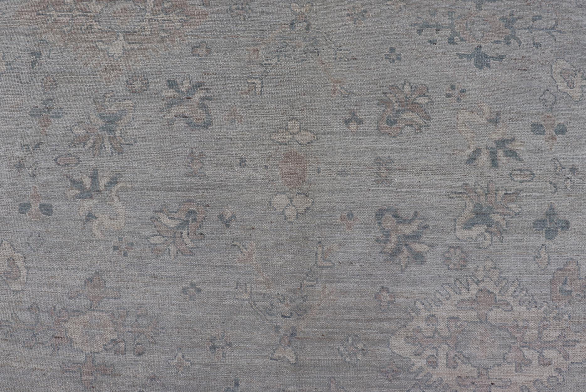 Modern All - Over Floral Oushak with Light Gray Background And Neutral Colors Keivan Woven Arts rug AWR - 8468 Country of Origin: Afghanistan Type: Oushak Design: Floral, All - Over, Abstract Floral. Measures: 9'0 x 11'9 This Oushak was hand - knott... - Keivan Woven ArtsAWR - 8468 - 21257Rug