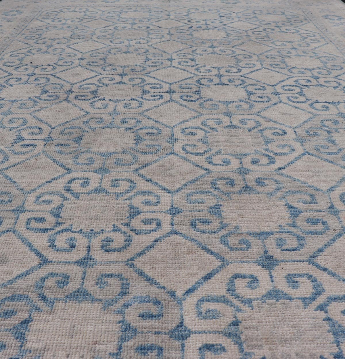 Modern All - Over Tribal Motif Khotan Area Rug in Muted Blues and Cream. Country of Origin: Afghanistan; Type: Khotan; Design: Floral, All - Over; Keivan Woven Arts: rug/AWR - 8474 Measures: 4'10 x 7'3 This modern Khotan features a modern muted blue's... - Keivan Woven ArtsAWR - 8474 - 21355Rug