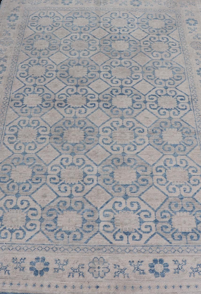 Modern All - Over Tribal Motif Khotan Area Rug in Muted Blues and Cream. Country of Origin: Afghanistan; Type: Khotan; Design: Floral, All - Over; Keivan Woven Arts: rug/AWR - 8474 Measures: 4'10 x 7'3 This modern Khotan features a modern muted blue's... - Keivan Woven ArtsAWR - 8474 - 21355Rug