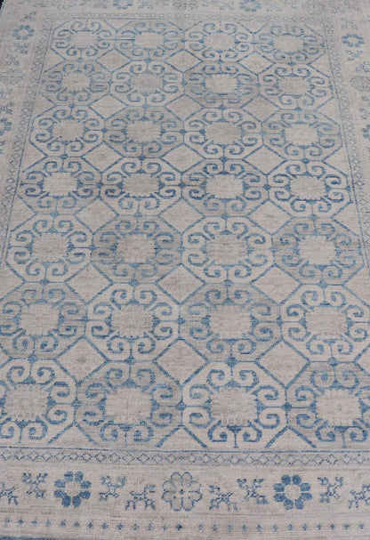 Modern All - Over Tribal Motif Khotan Area Rug in Muted Blues and Cream. Country of Origin: Afghanistan; Type: Khotan; Design: Floral, All - Over; Keivan Woven Arts: rug/AWR - 8474 Measures: 4'10 x 7'3 This modern Khotan features a modern muted blue's... - Keivan Woven ArtsAWR - 8474 - 21355Rug