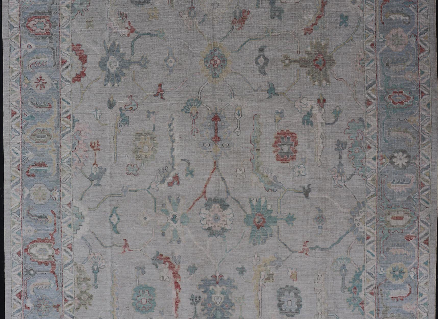 Large Modern Oushak with floral design on light blue/gray border with pops of color. Keivan Woven Arts; rug AWR - 9004 Country of Origin: Afghanistan Type: Oushak Design: Mosaic Floral, All - Over. 21st century. Measures: 10'1 x 13'10. The fi... - Keivan Woven ArtsAWR - 9004 - 21311Rug
