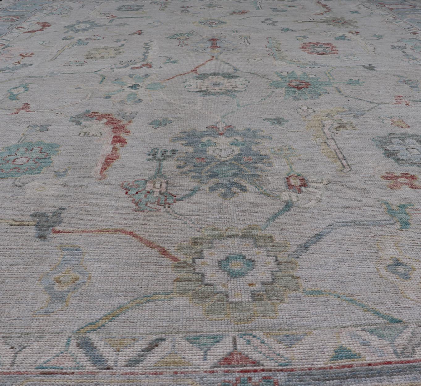Large Modern Oushak with floral design on light blue/gray border with pops of color. Keivan Woven Arts; rug AWR - 9004 Country of Origin: Afghanistan Type: Oushak Design: Mosaic Floral, All - Over. 21st century. Measures: 10'1 x 13'10. The fi... - Keivan Woven ArtsAWR - 9004 - 21311Rug