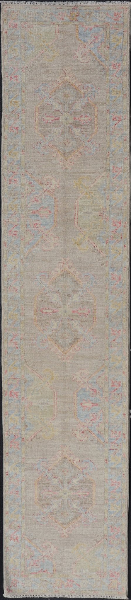 Hand - Knotted Oushak Runner With Medallion Design on a Tan Field With Red & Blue. Keivan Woven Arts; rug AWR - AR118 Country of Origin: Afghanistan Type: Oushak Design: Medallion, Motif, Floral Motif This modern piece holds large medallions in the ... - Keivan Woven ArtsAWR - AR118 - 17178Rug
