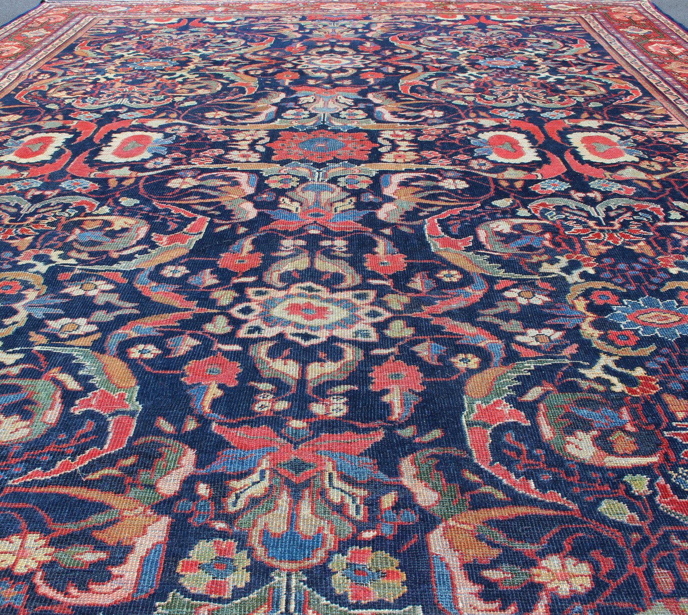Colorful Antique Persian Sultanabad Rug with Navy Blue Field and Red Border. Antique Persian Sultanabad in Blue background and colorful field. Keivan Woven Arts/rug/ B - 0536, country of origin / type: Iran / Sultanabad, circa 1910 Measures: 9 x 1... - Keivan Woven ArtsB - 0536 - 621Rug