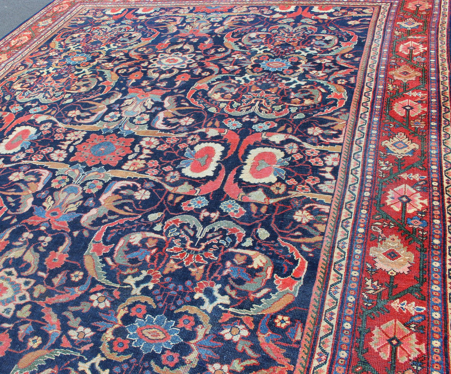 Colorful Antique Persian Sultanabad Rug with Navy Blue Field and Red Border. Antique Persian Sultanabad in Blue background and colorful field. Keivan Woven Arts/rug/ B - 0536, country of origin / type: Iran / Sultanabad, circa 1910 Measures: 9 x 1... - Keivan Woven ArtsB - 0536 - 621Rug