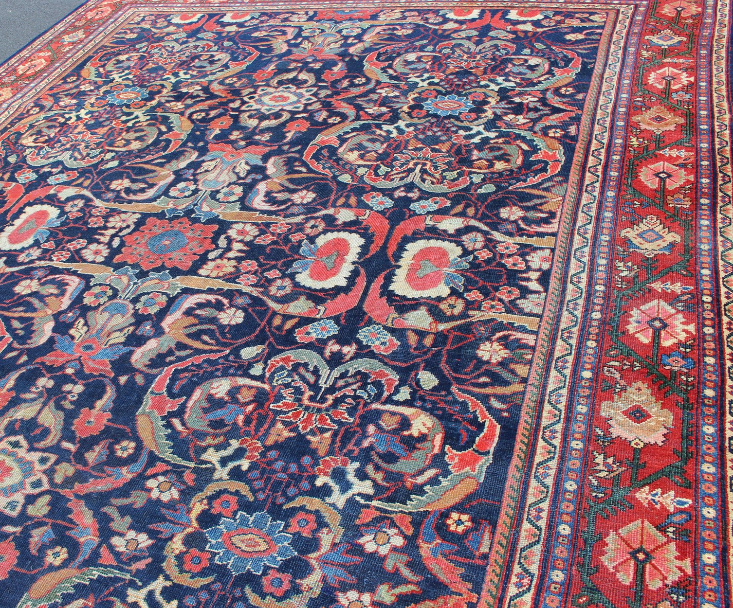 Colorful Antique Persian Sultanabad Rug with Navy Blue Field and Red Border. Antique Persian Sultanabad in Blue background and colorful field. Keivan Woven Arts/rug/ B - 0536, country of origin / type: Iran / Sultanabad, circa 1910 Measures: 9 x 1... - Keivan Woven ArtsB - 0536 - 621Rug