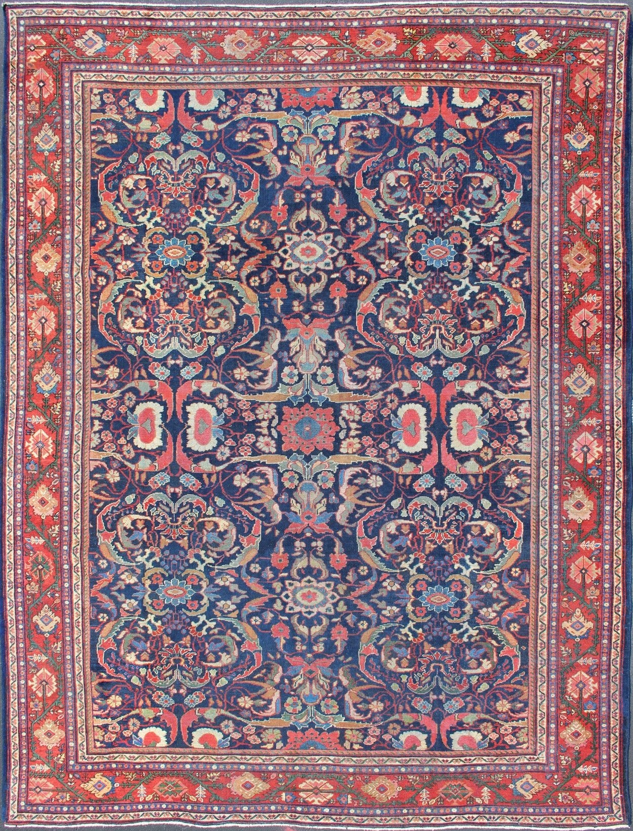 Colorful Antique Persian Sultanabad Rug with Navy Blue Field and Red Border. Antique Persian Sultanabad in Blue background and colorful field. Keivan Woven Arts/rug/ B - 0536, country of origin / type: Iran / Sultanabad, circa 1910 Measures: 9 x 1... - Keivan Woven ArtsB - 0536 - 621Rug