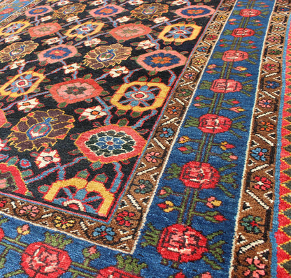 Antique Persian Bakhtiari Rug This antique Persian Bakhtiar rug features an all - over floral pattern in vivid colors of pink, yellow, coral, orange, blue and hints of ivory. The blue border consists of pink and coral flowers with green vines. The... - Keivan Woven ArtsB - 0713 - 2201Rug