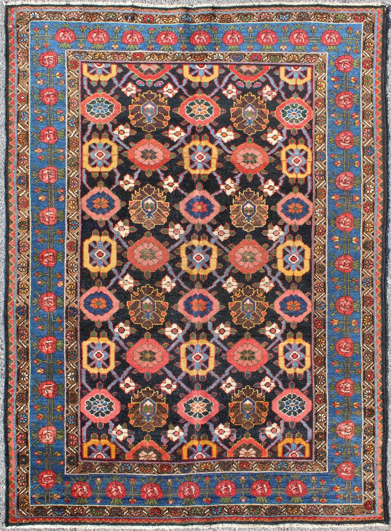 Antique Persian Bakhtiari Rug This antique Persian Bakhtiar rug features an all - over floral pattern in vivid colors of pink, yellow, coral, orange, blue and hints of ivory. The blue border consists of pink and coral flowers with green vines. The... - Keivan Woven ArtsB - 0713 - 2201Rug