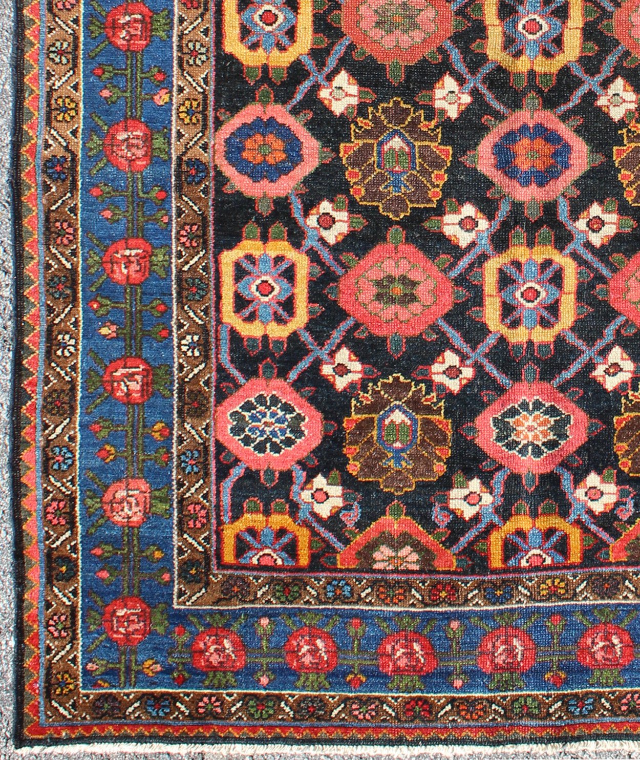 Antique Persian Bakhtiari Rug This antique Persian Bakhtiar rug features an all - over floral pattern in vivid colors of pink, yellow, coral, orange, blue and hints of ivory. The blue border consists of pink and coral flowers with green vines. The... - Keivan Woven ArtsB - 0713 - 2201Rug