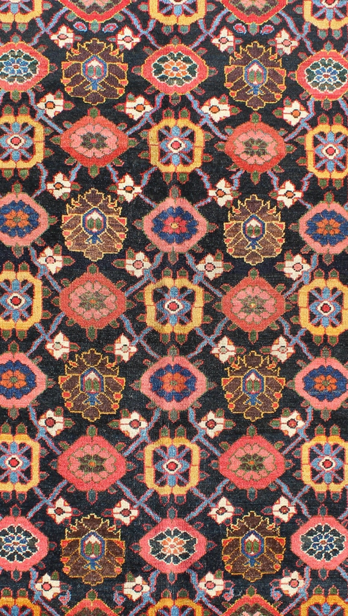 Antique Persian Bakhtiari Rug This antique Persian Bakhtiar rug features an all - over floral pattern in vivid colors of pink, yellow, coral, orange, blue and hints of ivory. The blue border consists of pink and coral flowers with green vines. The... - Keivan Woven ArtsB - 0713 - 2201Rug