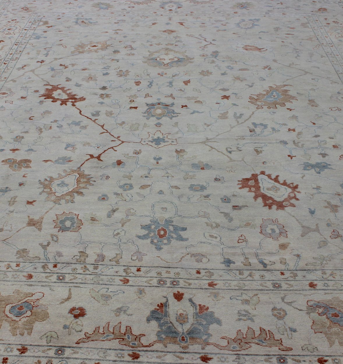 Modern Hand Knotted Oushak Muted Rug in Coral and Light Blue Measures 12 x 15 This hand knotted Oushak rug features a beautiful classic Oushak floral design, rendered in red, blue, terra cotta, and ivory. The field and border are harmon... - Keivan Woven ArtsBDH - 742865 - 10876Rug