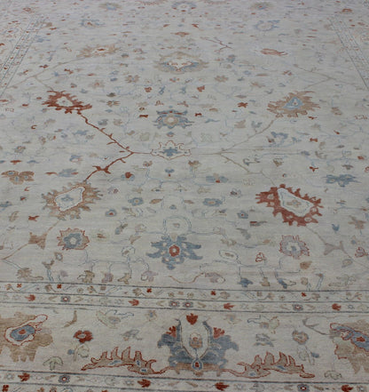 Modern Hand Knotted Oushak Muted Rug in Coral and Light Blue Measures 12 x 15 This hand knotted Oushak rug features a beautiful classic Oushak floral design, rendered in red, blue, terra cotta, and ivory. The field and border are harmon... - Keivan Woven ArtsBDH - 742865 - 10876Rug