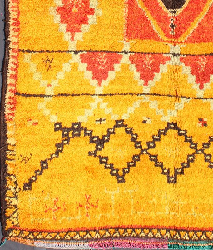 Saffron Colored Antique Moroccan Carpet with Tribal Geometric Design Keivan Woven Arts Measures: 4'4'' x 6'6''. Crafted in the mid - 20th century, this gorgeous Antique Moroccan Rug bears a body of saffron and soft orange and golden hues. Fi... - Keivan Woven ArtsBDS - 136603 - 7267Rug