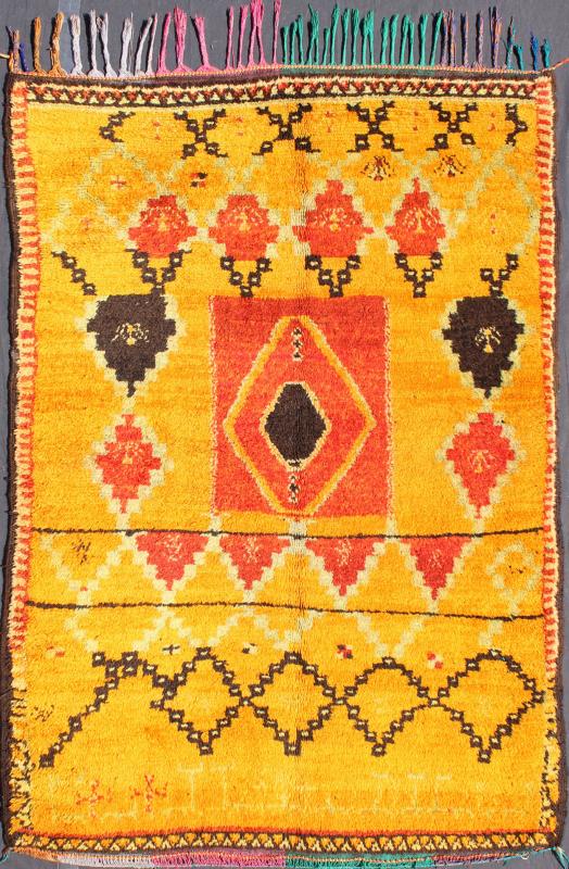 Saffron Colored Antique Moroccan Carpet with Tribal Geometric Design Keivan Woven Arts Measures: 4'4'' x 6'6''. Crafted in the mid - 20th century, this gorgeous Antique Moroccan Rug bears a body of saffron and soft orange and golden hues. Fi... - Keivan Woven ArtsBDS - 136603 - 7267