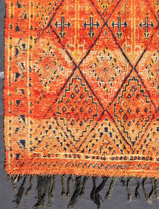 Vintage Moroccan Beni Mklid Rug in Oranges and Creams with Deep Navy Blue Measures: 5'11'' x 10'4''. Woven on a gorgeous luscious black wool base, this original vintage carpet features finely structured diamonds flanked by skillfully woven sy... - Keivan Woven ArtsBDS - 136614 - 7271Rug