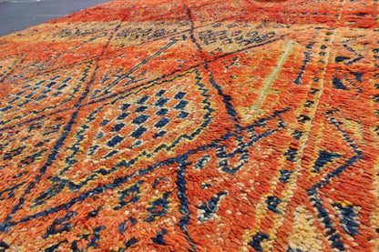 Vintage Moroccan Beni Mklid Rug in Oranges and Creams with Deep Navy Blue Measures: 5'11'' x 10'4''. Woven on a gorgeous luscious black wool base, this original vintage carpet features finely structured diamonds flanked by skillfully woven sy... - Keivan Woven ArtsBDS - 136614 - 7271Rug