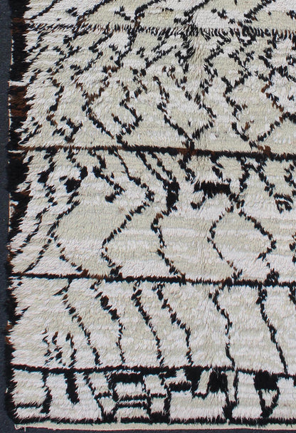 Vintage Moroccan Azilal Rug in White/Cream and Black for Modern Interiors This exquisite piece features a graphic handwoven Berber design with randomly drawn highlights, this piece is packed with motifs and symbols. The white or ivory colors are... - Keivan Woven ArtsBDS - 136622 - 7279Rug