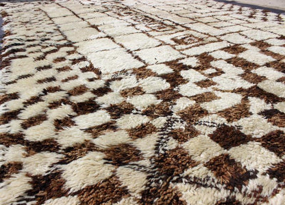 Large Vintage Moroccan Beni Ourain Rug in Browns, Mocha and Cream Measures: 7'5'' x 13'7''. This fabulously complex and interesting carpet features principally lozenge - based designs with a lattice flanked by checkered and diamond shapes fille... - Keivan Woven ArtsBDS - 136632 - 7295Rug