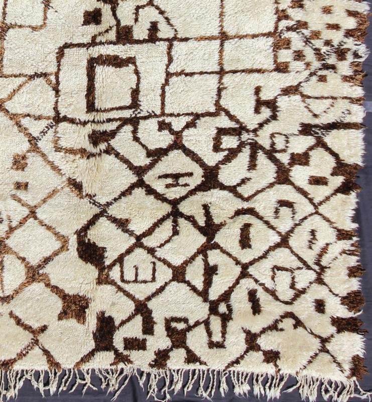 Large Vintage Moroccan Beni Ourain Rug in Browns, Mocha and Cream Measures: 7'5'' x 13'7''. This fabulously complex and interesting carpet features principally lozenge - based designs with a lattice flanked by checkered and diamond shapes fille... - Keivan Woven ArtsBDS - 136632 - 7295Rug