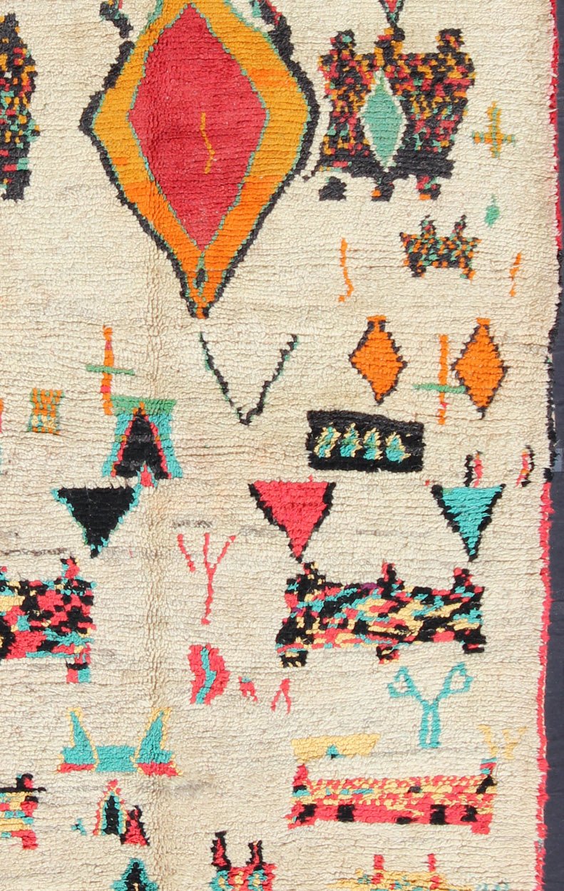 Vintage Moroccan Azilal Rug with Tribal design in bright Colors. This Moroccan carpet offers comfort and warmth with a neutral field and vivid color palette. Keivan Woven Arts Rug/BDS - 136634. Set on an off white background, this rug features s... - Keivan Woven ArtsBDS - 136634 - 7299Rug