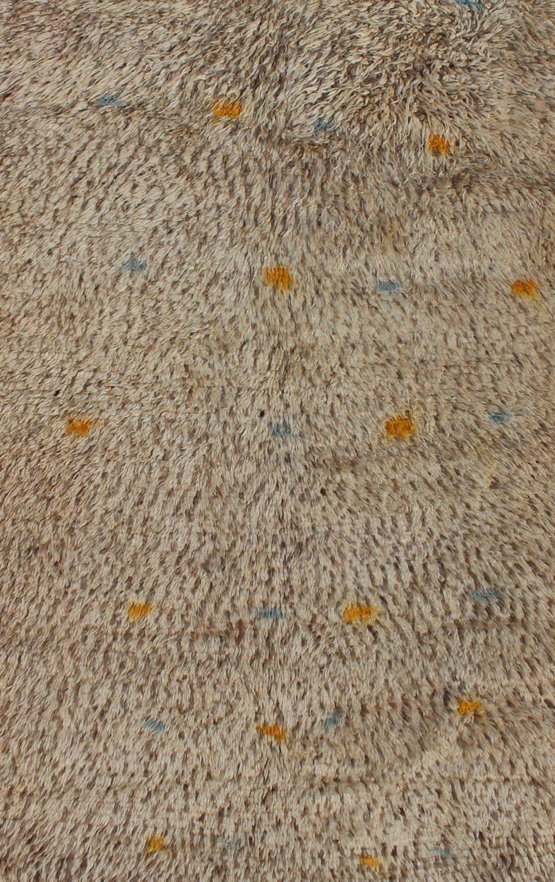 Vintage Moroccan Rug On A Taupe Field With Pops of Blue and Yellow Vintage Moroccan Rug On A Taupe Field With Pops of Blue and Yellow. rug BDS - 20124, Keivan Woven Arts / country of origin / type: Morocco / Tribal, circa 1940. This uniq... - Keivan Woven ArtsBDS - 20124 - 9571Rug