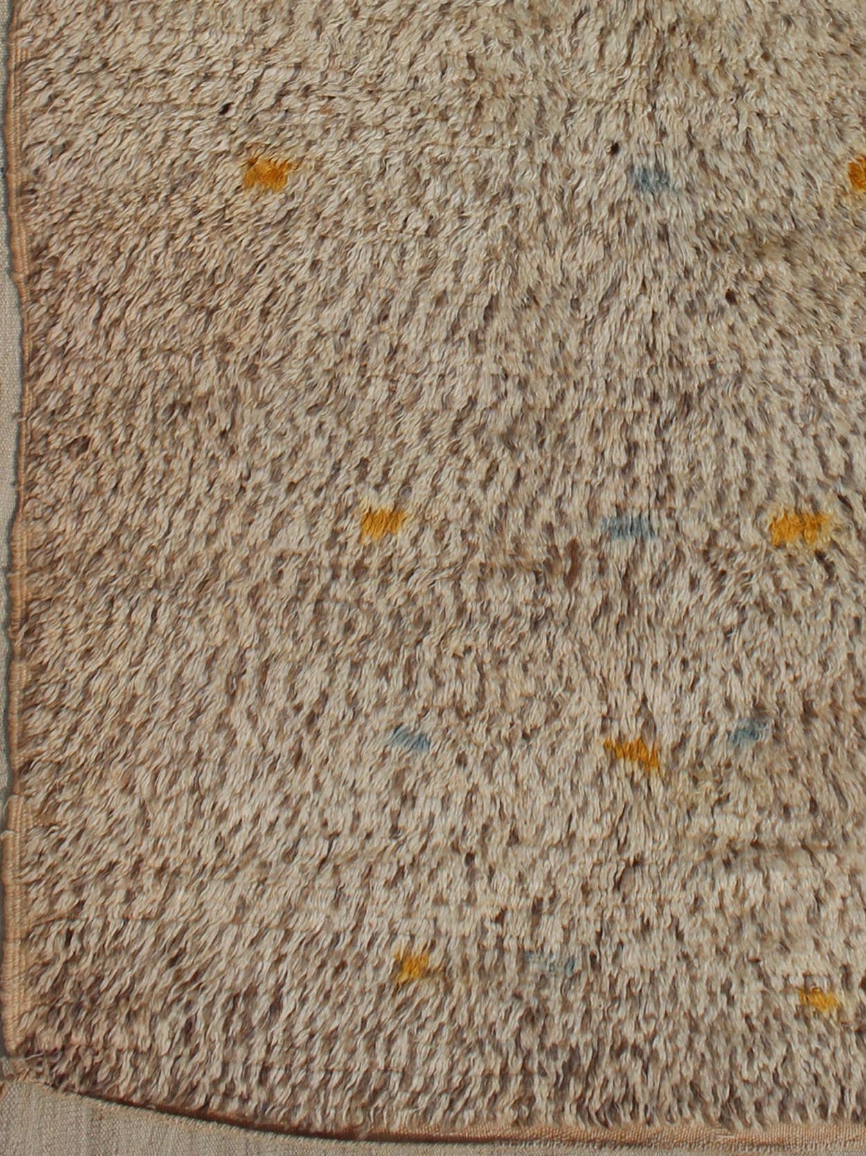 Vintage Moroccan Rug On A Taupe Field With Pops of Blue and Yellow Vintage Moroccan Rug On A Taupe Field With Pops of Blue and Yellow. rug BDS - 20124, Keivan Woven Arts / country of origin / type: Morocco / Tribal, circa 1940. This uniq... - Keivan Woven ArtsBDS - 20124 - 9571Rug