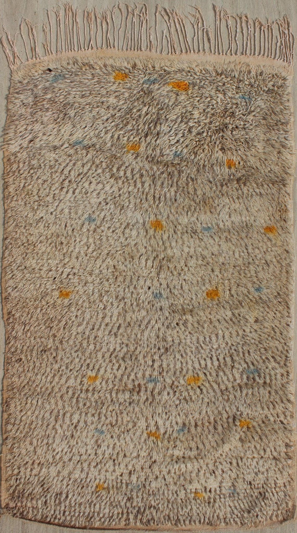 Vintage Moroccan Rug On A Taupe Field With Pops of Blue and Yellow Vintage Moroccan Rug On A Taupe Field With Pops of Blue and Yellow. rug BDS - 20124, Keivan Woven Arts / country of origin / type: Morocco / Tribal, circa 1940. This uniq... - Keivan Woven ArtsBDS - 20124 - 9571Rug