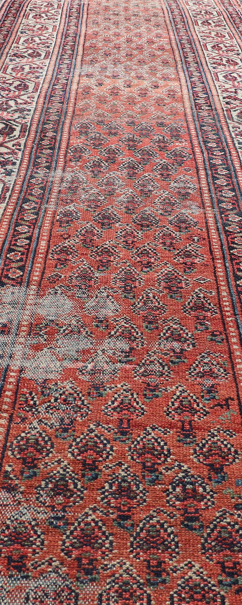Distressed Antique Persian Malayer Runner with Field of Paisleys Design in Red Measures 3'2 x 15'2 This century old Persian Malayer defines the craftsmanship of this era. The multi - tier border features inner and outer guards decorat... - Keivan Woven ArtsBW - 1 - 20860Rug