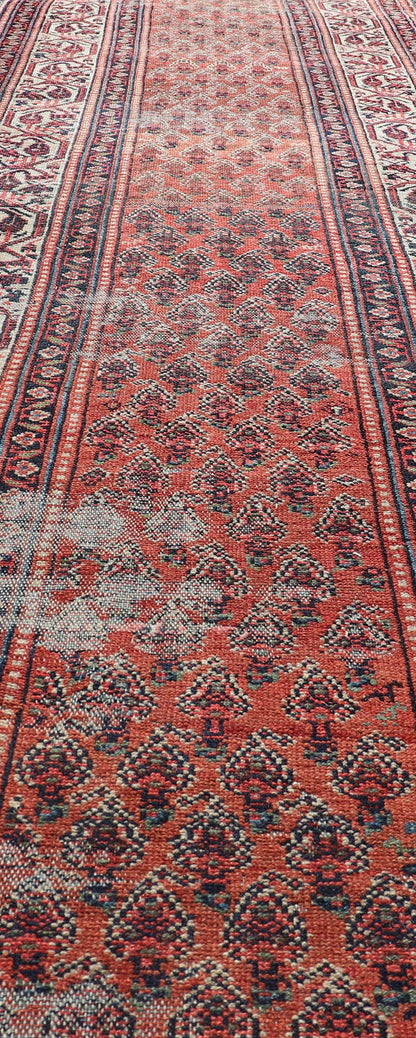 Distressed Antique Persian Malayer Runner with Field of Paisleys Design in Red Measures 3'2 x 15'2 This century old Persian Malayer defines the craftsmanship of this era. The multi - tier border features inner and outer guards decorat... - Keivan Woven ArtsBW - 1 - 20860Rug